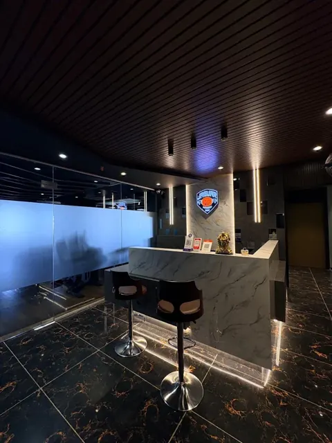 Marble-finish reception desk with the illuminated Jaguar shield